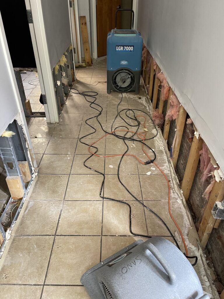 Water damage restoration equipment set up in a Wilmington home